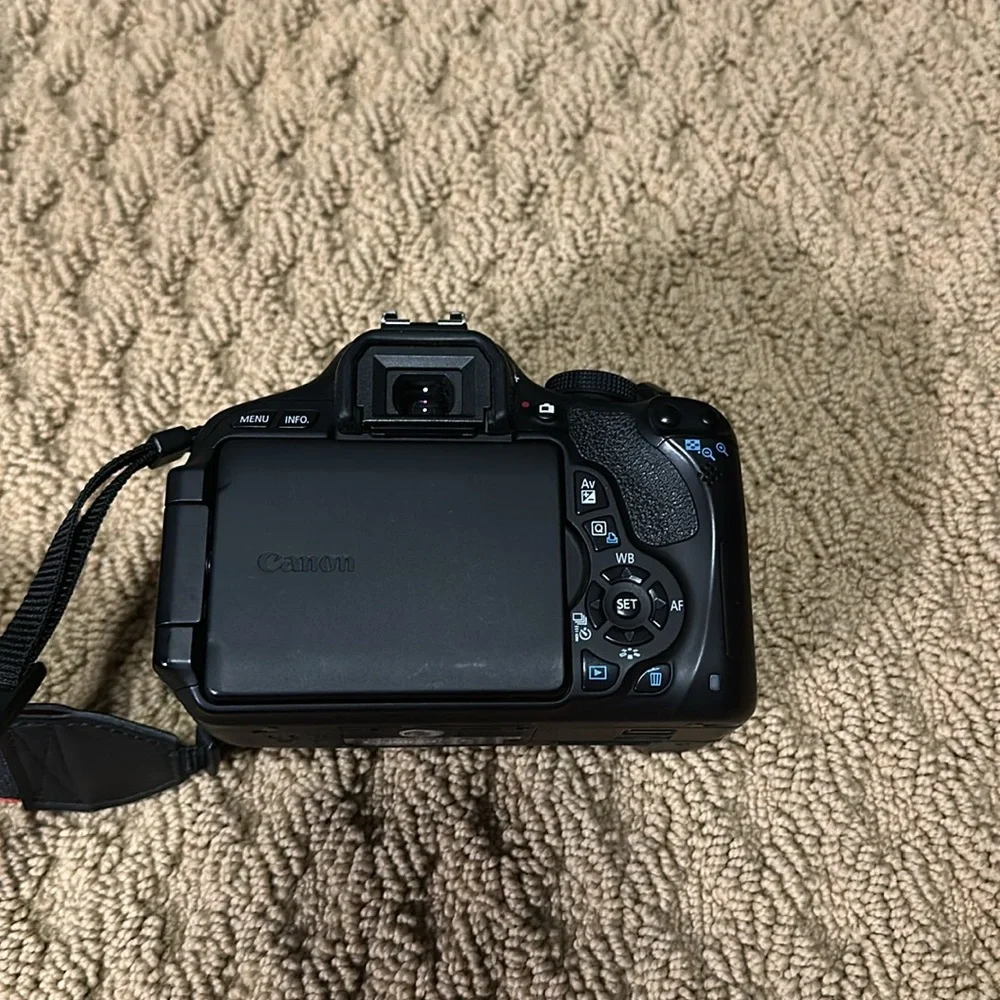 Canon eos rebel t3i with case and two lenses.
